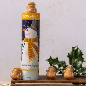 a kraft tube of gold chocolate Christmas snowmen hand crafted by Chococo surrounded by real holly 