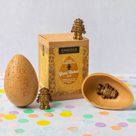gold chocolate easter egg with milk chocolate robot inside made by chococo 