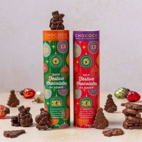 Milk Chocolate festive shapes of snowmen, Santas, and tress by Chococo in a kraft tube with baubles scattered around 