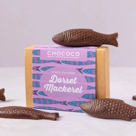 Dorset Mackerel fish shapes made from dark chocolate by Chococo proudly hand craft on top of box 