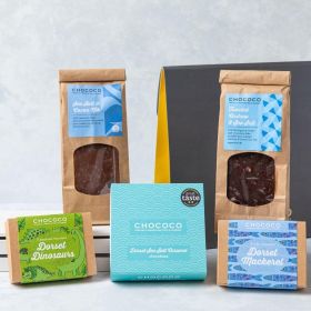 THe Dorset Chocolate Hamper by Chococo with novelty dino shapes and fish, milk and dark chocolate slabs ad a box of 9 Dorset sea salt chocolate 