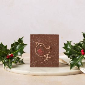 milk chocolate mini bar by chococo with hand piped Christmas robin decoration, in grey packaging surround by real holly with red berries  