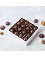 A close up of 16 Dorset Sea Salted Caramel chocolates in a box 