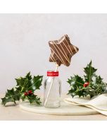 milk chocolate honeycomb star handcrafted in Dorset by Chococo sat in a milk jar with holly and linen napkin surround 