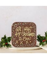 A giant milk chocolate message bar by Chococo which is hand piped with a personalised now saying 'all I want for Christmas is you!' 