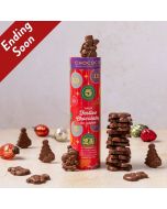 Milk Chocolate festive shapes of snowmen, Santas, and tress by Chococo in a kraft tube with baubles scattered around 